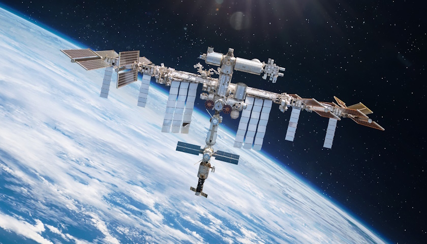 Composite image showing the International Space Station in orbit above Earth